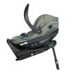 Side profile of BeSafe Beyond Isofix Base with support leg extended and cradling a BeSafe Go Beyond2 infant car seat in Meadow Green SoftBreeze fabric, available from Parent Studio.