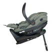 Side profile of BeSafe Beyond Isofix Base with support leg extended and cradling a BeSafe Go Beyond2 infant car seat in Meadow Green SoftBreeze fabric in lay-flat position, available from Parent Studio