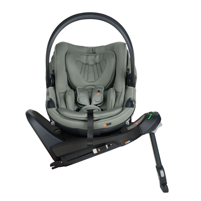 Rear view of BeSafe Beyond Isofix Base with support leg extended and cradling a BeSafe Go Beyond2 infant car seat in Meadow Green SoftBreeze fabric, available from Parent Studio