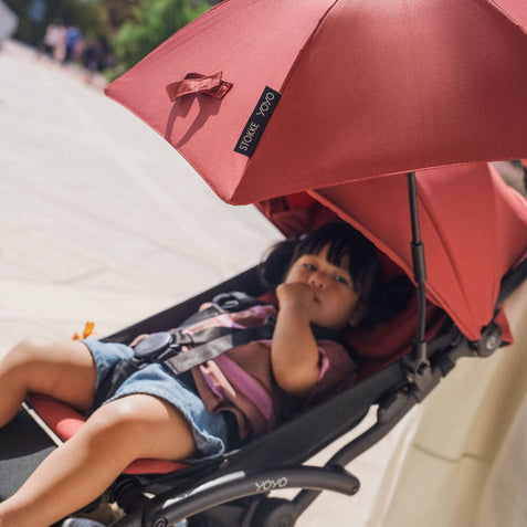 Stokke YOYO stroller parasol in Berry attached to stroller frame - Available at Parent Studio.