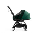 Stokke YOYO Bassinet Mesh Cover fitted tightly over a Forest Green Yoyo5 bassinet - Available from Parent Studio