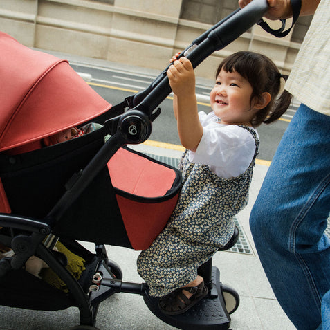 Side Profile lifestyle image of Stokke Yoyo Board toddler sibling solution for Yoyo Stroller - Available from Parent Studio
