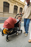 Stokke Yoyo Board toddler sibling solution  in use by toddler behind a yoyo5 Stroller - Available from Parent Studio