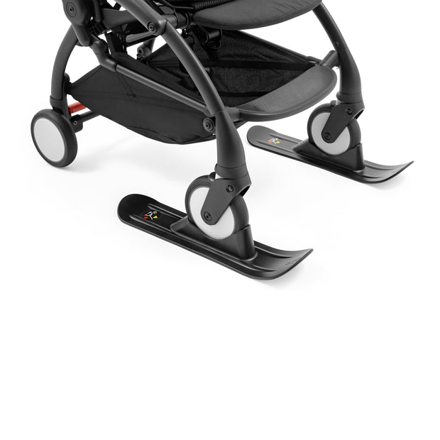 Stokke YOYO skis in black attached to the front wheels of a stroller frame - Available from Parent Studio