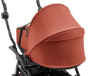 Black Stokke YOYO5 Bassinet Adapters showing the clip-in locking mechanism and Stokke YOYO5 Berry bassinet securely attached - Available from Parent Studio