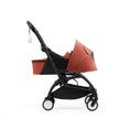 Profile view of a  Stokke YOYO5 stroller fitted with Berry Newborn Pack - Available from Parent Studio
