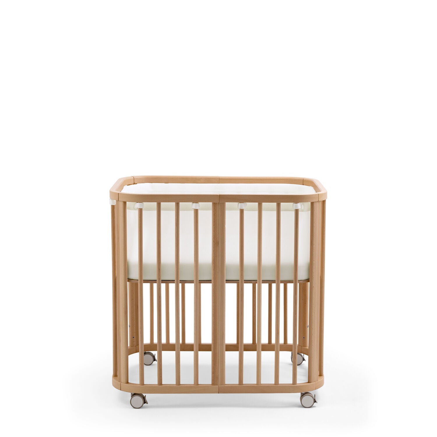 Stokke Nighti Mini Breathable Mesh Liner fitted securely inside a natural wooden newborn crib - Available from Parent Studio London
