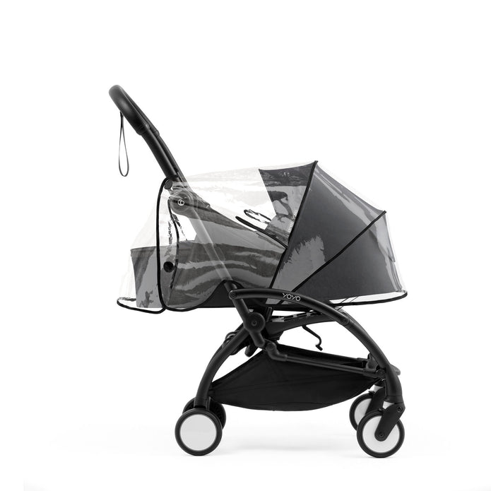 Transparent rain cover secured over a Black YOYO5 newborn pack on a Yoyo5 base frame - Available from Parent Studio