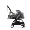 Transparent rain cover secured over a Black YOYO5 newborn pack on a Yoyo5 base frame - Available from Parent Studio