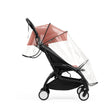 Clear Stokke YOYO seat pack rain cover fitted securely over a Berry Yoyo5 seat pack and hood - Available from Parent Studio