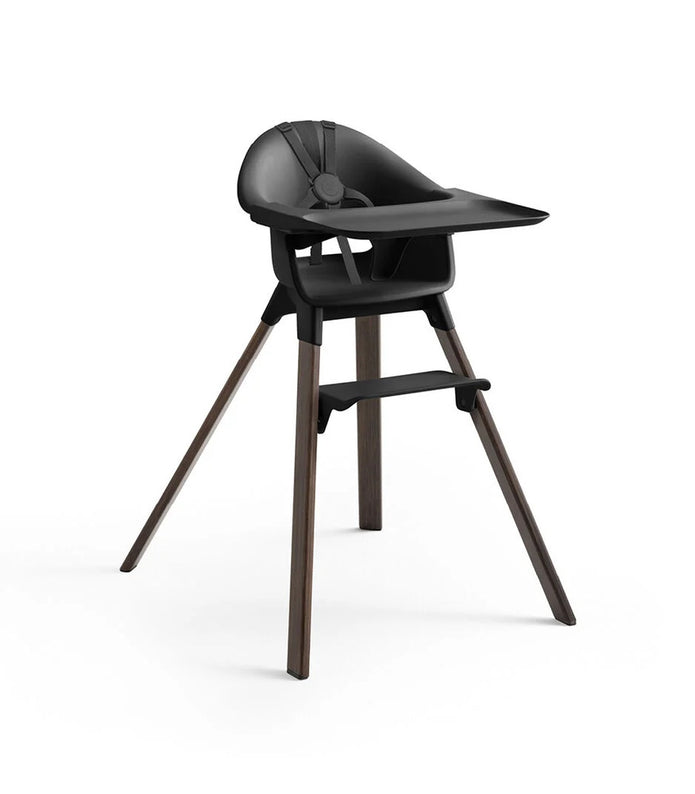 Black high chair with wooden legs on a white background