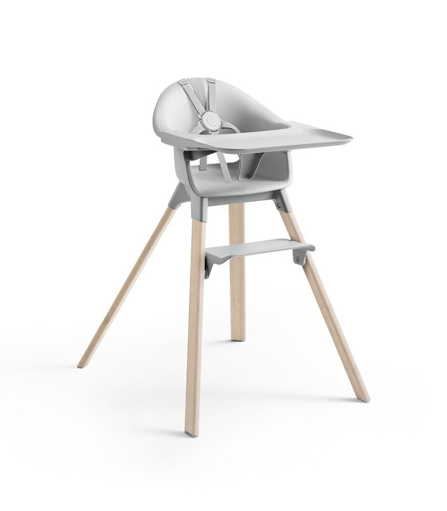 Children's high chair with gray seat and wooden legs on a white background