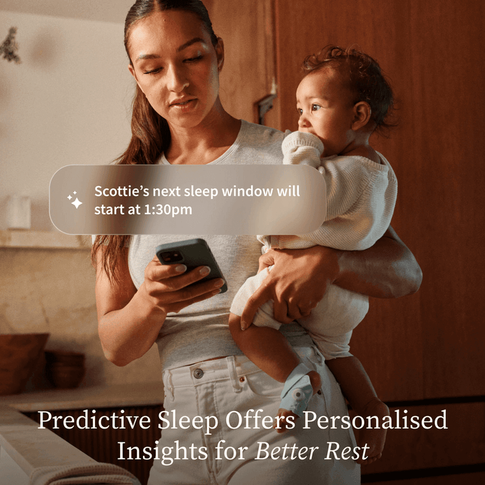 Woman holding a child and looking at a phone with text about predictive sleep.