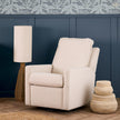 Beige recliner chair in a room with a blue wall and decorative elements.