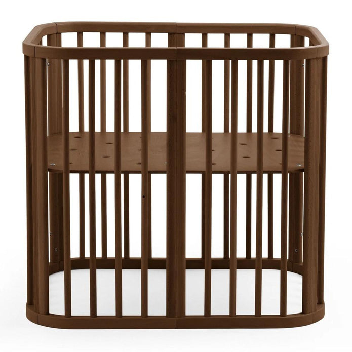 Stokke Nighti mini cot in warm brown finish  — Available from Parent Studio