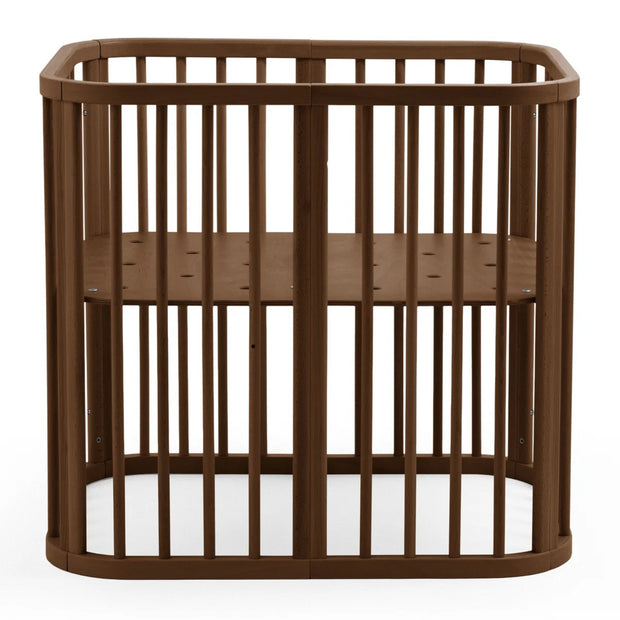 Stokke Nighti mini cot in warm brown finish  — Available from Parent Studio